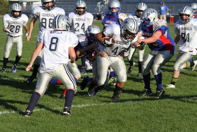 Chance Augustine of the Generals B-Team fights off a horde of Amesbury players after recovering a fumble heading to the end 

zone, Sept. 27.

Courtesy photo