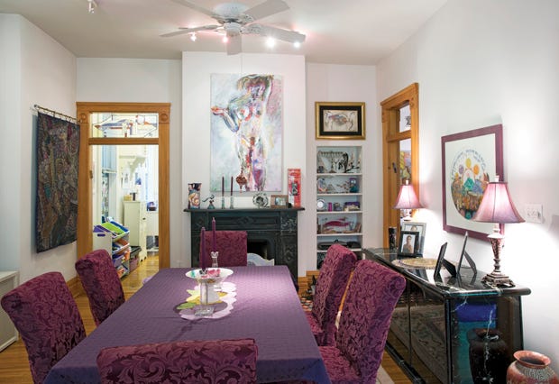 From the art on the walls to the rugs, Suzanne and Norman Schneiderman's home in The Circles features plenty of Suzanne's favorite hue: purple.