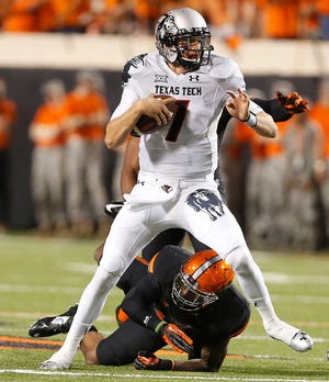 Texas Tech quarterback Davis Webb's status for this week is unknown after a shoulder injury against Oklahoma State. (Zach Long)