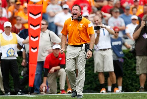 Tennessee head coach Butch Jones yells at an official in Saturday's game versus Georgia.