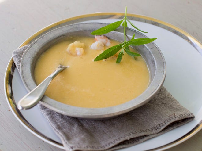 Coconut Butternut Squash Soup is pureed until smooth, then shrimp or shredded chicken is stirred in.