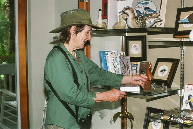 Jane Weber, who will speak about 'Birds of Central Florida' at 2 p.m. Saturday, Oct. 4, 2014, sets up a bird-oriented display on Saturday, Sept. 27, 2014, at the Dunnellon branch of the Marion County Library. Submitted photo.