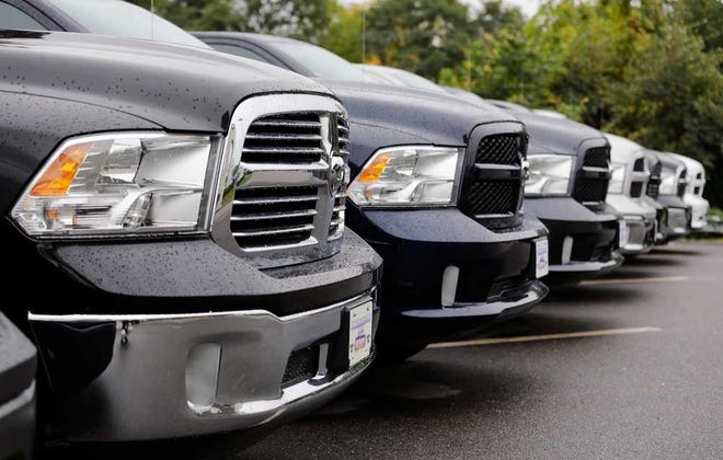 Charles Krupa/The Associated Press Dodge Ram pickup trucks are lined up for sale at Bill DeLuca's dealerships in Haverhill, Mass. Chrysler Group says its U.S. sales rose 19 percent in September.