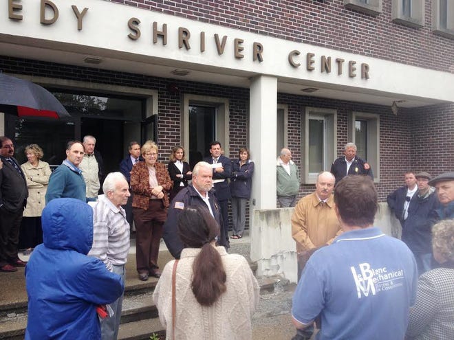 A group of officials meets at the Eunice Kennedy Shriver Center during a tour of the Fernald land in Waltham on Tuesday. WICKED LOCAL PHOTO / ELI SHERMAN