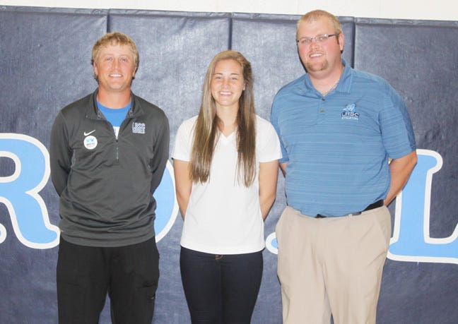 Lake Region State College head golf coach Blake Reinholt, women’s golf national golf qualifier Kelsey Schlenk and athletic director Danny Mertens.