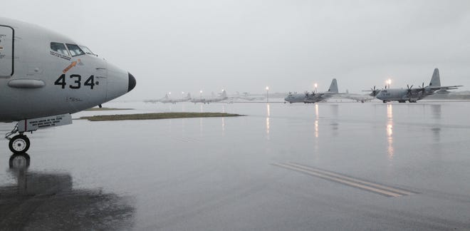 VP-45's P-8A Poseidon No. 434 is rinsed off by one of the frequent tropical downpours on the ramp at Andersen Air Force Base in the United States Territory of Guam.