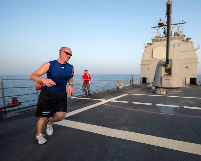 Lt. j.g. Robert Allen runs on the weather decks aboard the guided-missile cruiser USS Philippine Sea (CG 58). Philippine Sea is deployed as part of the George H.W. Bush Carrier Strike Group supporting maritime security operations and theater security cooperation efforts in the U.S. 5th Fleet area of responsibility.