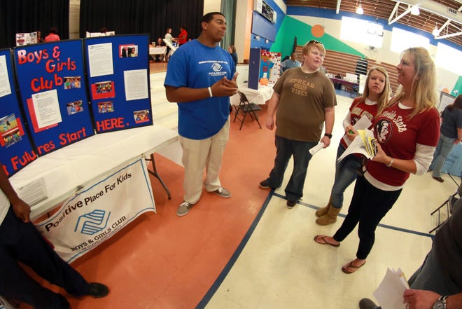 Representatives of the Cleveland County Boys & Girls Club speak with potential volunteers at the 2013 Connect, Commit to Change. STAR FILE PHOTO