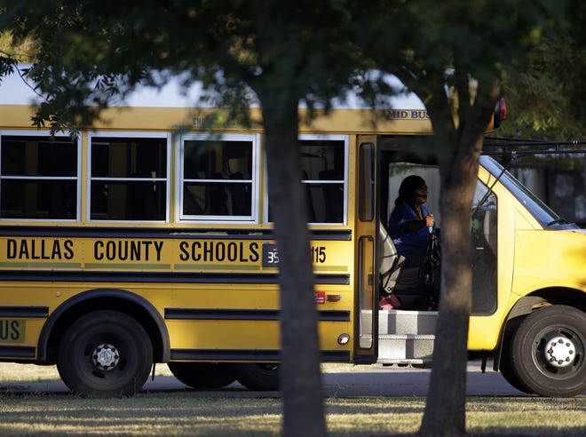 A Dallas Independent School District bus departs L.L. Hotchkiss Elementary school after dropping off students in Dallas. Hotchkiss has been identified by the Dallas Independent School District as one of the schools where one or more of the students attend that came in contact with the man diagnosed with having the Ebola virus.