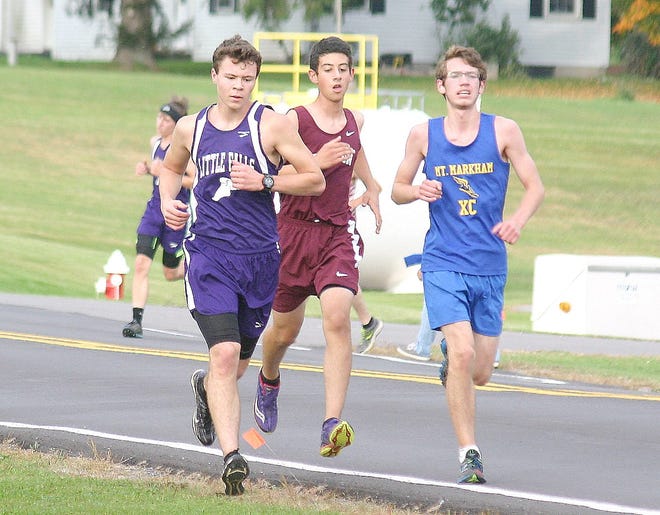 Little Falls' Austin Green (left) and Mt. Markham's Nick Rodick run along Fairgrounds Road in Winfield Wednesday. Green and Rodick were their teams' top finishers at a five-school meet.



Times Photo/Jon Rathbun