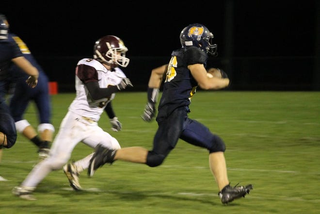 Junior running back Jared Smith blows by a Viking defender during the Pirates 54-6 win over Potterville on Friday night.