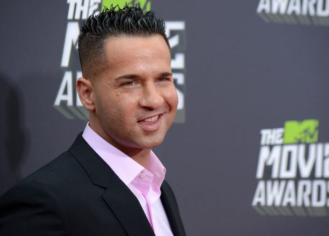 TV personality Mike Sorrentino, also known as The Situation, arrives at the MTV Movie Awards in Culver City, Calif., in 2013.