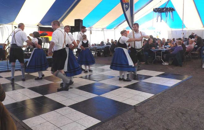 The Blautaler Verein Schuhplatter perform a farmers dance Saturday at Oktoberfest in Fairlawn Plaza.