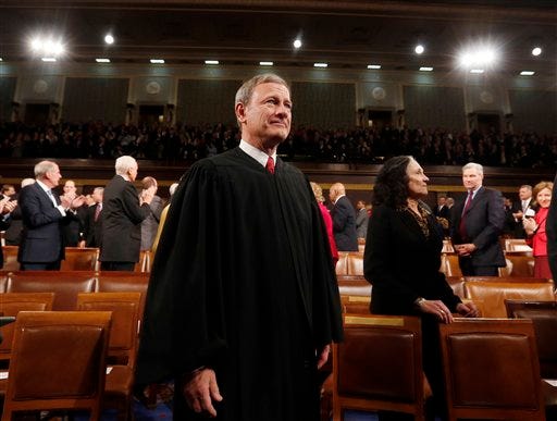 This Jan. 28, 2014 file photo shows Supreme Court Chief Justice John Roberts in the House chamber on Capitol Hill waiting for the President's State of the Union address to begin. Roberts is beginning his 10th year at the head of the Supreme Court, and the fifth with the same lineup of justices. He has been part of a five-justice conservative majority that has rolled back campaign finance limits, upheld abortion restrictions and been generally skeptical of the consideration of race in public life. But his court has taken a different path in cases involving gay and lesbian Americans, despite the chief justice's opposition most of the time. (AP Photo/Larry Downing, Pool)