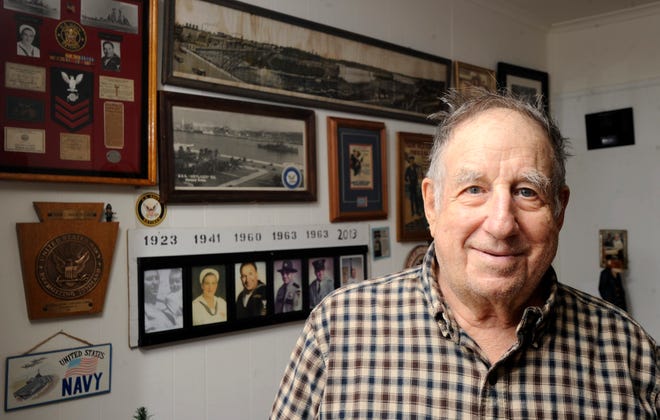 Dennis Rinaldi Sr. stands in front of one of the walls of his Stroudsburg home which is adorned with mementos from his time serving with the U.S. Navy.(Keith R. Stevenson/Pocono Record)