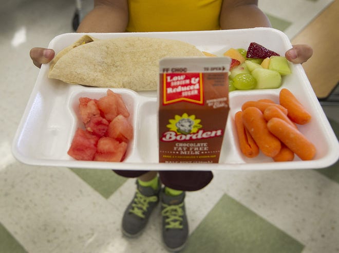 A refried bean burrito with reduced-fat American cheese on a ultra-grain tortilla was one option served on Monday, Sept. 8, 2014 at Rooster Springs Elementary School in Dripping Springs, Texas. Also included are a fresh fruit salad mix, baby carrots, watermelon and skim chocolate milk.