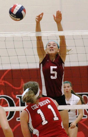 Portsmouth High School's Ivy Chace goes up for a block at the net during Monday night's Division II volleyball match at Coe-Brown. The Clippers lost the match 3-0. Al Pike/Foster's Daily Democrat