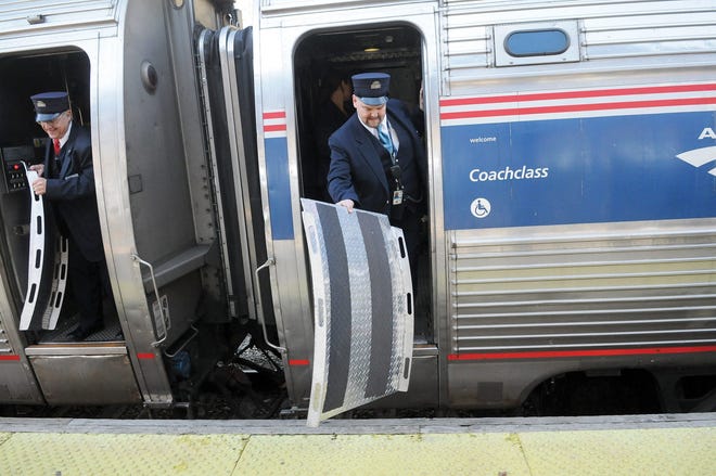 Conductors of the Downeaster train put the ramps out for passengers as they stop in Exeter on their way to the new stops added in Freeport and Brunswick, Maine.

Deb Cram file photo