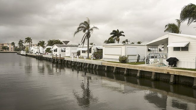 Mobile homes adjacent to canal inside the Briny Breezes community.