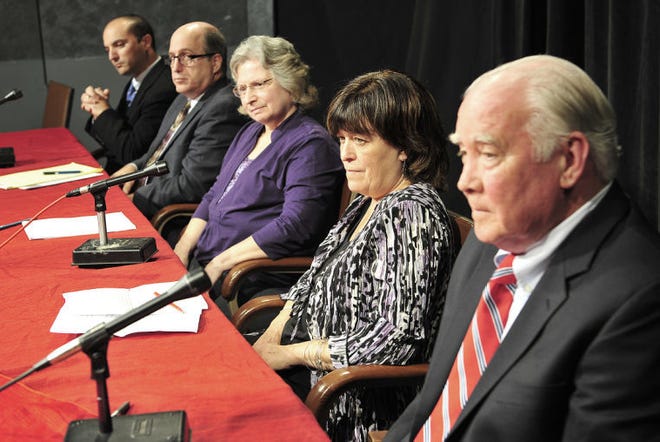 Tiverton council candidates L-R James Arruda, Michael S. Burk, Joan B. Chabot, Denise M. deMederios and Jay J. Lambert, listen to a cadidate answer a question duringthe Newport Daily news cadidate forum Wednesday in Portsmouth.