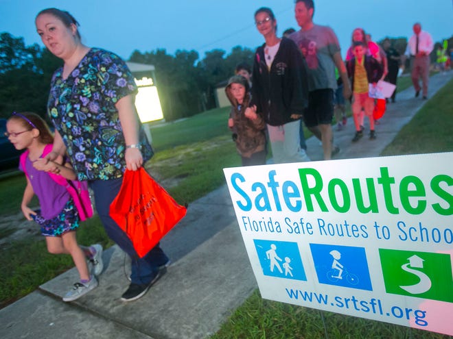 About forty parents, students and law enforcement officials took part in the annual International "Safe Walk to School Day" Wednesday morning in Belleview.