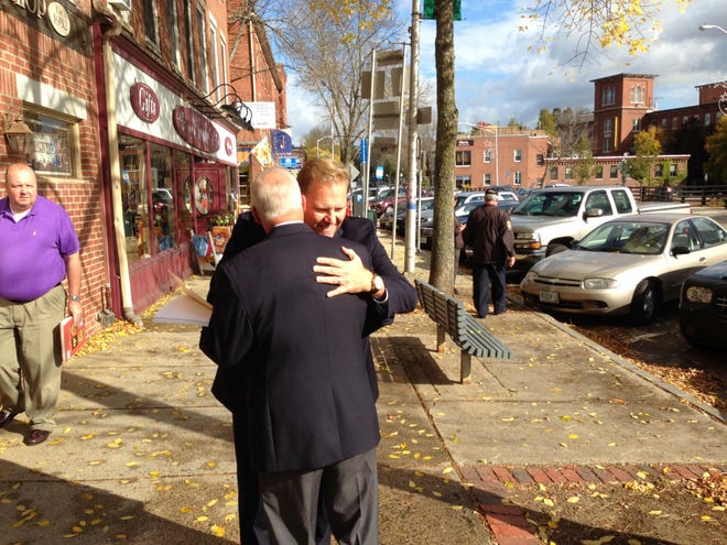 Gubernatorial candidate Walt Havenstein greets Congressman Mike Rogers of Michigan in downtown Dover Wednesday.