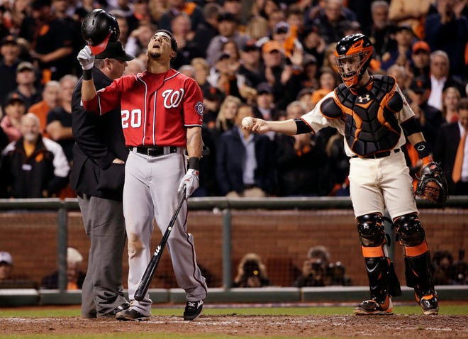 Washington Nationals Ian Desmond reacts after a strike call in the ninth inning against the San Francisco Giants during Game 4 of baseball's NL Division Series in San Francisco, Tuesday, Oct. 7, 2014. The Giants beat the Nationals 3-2 to advance to the next round. (AP Photo/Marcio Jose Sanchez)