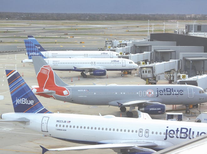 JetBlue planes sit on the tarmac at New York’s John F. Kennedy International Airport. The airline is considering adding daily, nonstop service to the Northwest Florida Beaches International Airport near West Bay.
