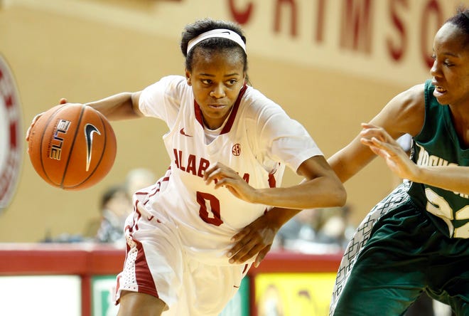 Alabama's Daisha Simmons (0) drives the ball as Jacksonville's Queen Alford (10) defends during an NCAA women's basketball game in Foster Auditorium in Tuscaloosa, Alabama on Tuesday Dec 17, 2013. staff photo | Robert Sutton