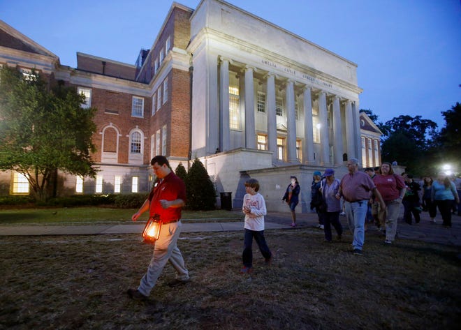 FILE - Todd Hester, museum naturalist and tour guide, leads a Ghost Tour, part of the third annual Haunting at the Museum, sponsored by the University of Alabama's Alabama Museum of Natural History Tuesday, Oct. 29, 2013. (Michelle Lepianka Carter / The Tuscaloosa News)