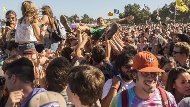 PLS USE AS LEDE IMAGE WITH COVER STORY A ACL fan Crowd surfs as Chidish Gambino performs at the Honda stage on Friday, Oct. 3 ,2014