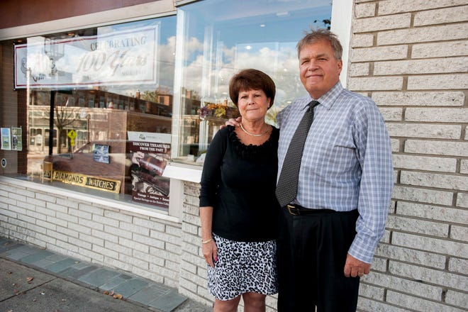 Martha and Leo Alie stand outside of their Dover location of Alie Jeweler's. The company and family is celebrating their 100th year in business.