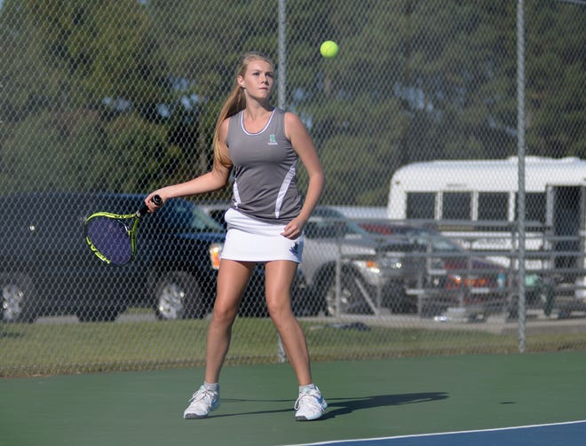 Zoie Daughety, a North Lenoir freshman, keeps her eye on the ball in her match during Monday's conference tennis tournament at the Greene Central tennis courts in Snow Hill.