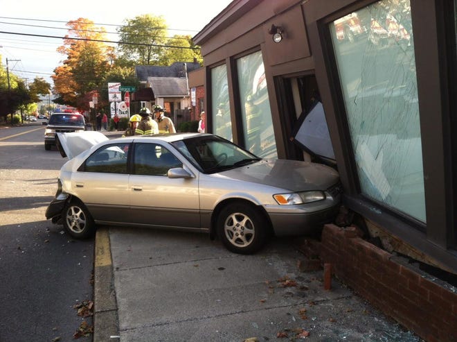North Courtland Street in East Stroudsburg, between King and East Second streets, is closed after this car crashed into what witnesses identified as the Pocono Cab Company office.