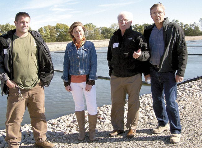 Adam Czajkowski, Amy Aldrich and Don Gloy are joined by Wayne Sherwood, representing the Fish Lake Association, at an open house Wednesday at the White Pigeon Township wastewater treatment plant.