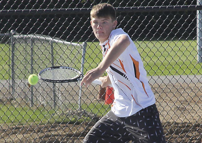 At No. 3 singles, Andrew Airgood chases down a shot Friday. Airgood was regional champion.