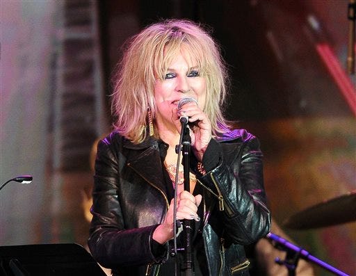 FILE - In this April 23, 2014 file photo, Lucinda Williams performs on stage at the 31st Annual ASCAP Pop Music Awards in Los Angeles. Williams released a new album, "Down Where the Spirit Meets the Bone," with 20 songs on two CDs. (Photo by Chris Pizzello/Invision/AP, File)
