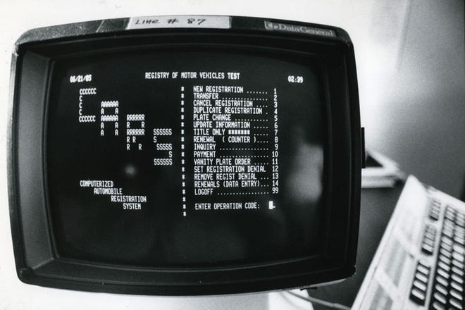 The Division of Motor Vehicles relies on a 1983 system to keep track of 783,747 accidents, 1.1 million emission test results, 1.6 million drivers and 3.9 million other records. A project to replace it is years past deadline. This file photo of an old state computer monitor is from June 1985.