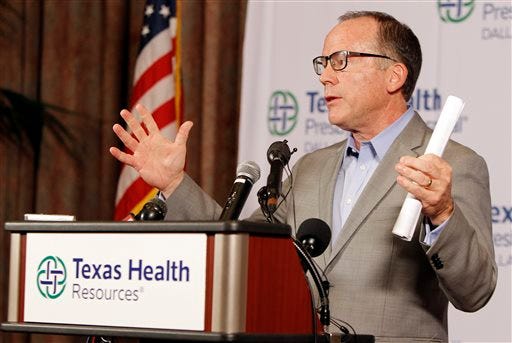Texas Health Presbyterian Hospital Chief Clinical Officer Dr. Daniel Varga answers questions about a health care worker who provided hospital care for Thomas Eric Duncan who contracted Ebola, during a press conference at the hospital, Sunday, Oct. 12, 2014, in Dallas. Varga says the worker was in full protective gear when they provided care to Duncan during his second visit to Texas Health Presbyterian Hospital. (AP Photo/Brandon Wade)