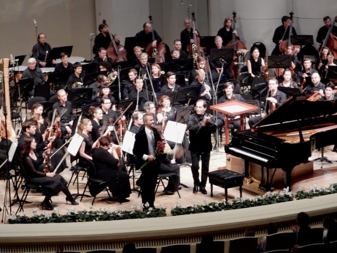 Soloists and conductor after Tchaikovsky's piano concerto No. 3 in Moscow on Saturday, Oct. 11, 2014. (Terry Ryan)