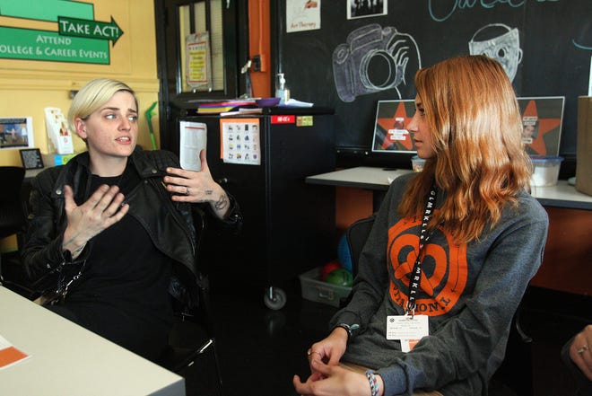 Kam Czysz (right), a senior at Freeport High School, listens to Melinda Cook, Freeport Middle School art teacher, during a Careers in Art session held Friday.