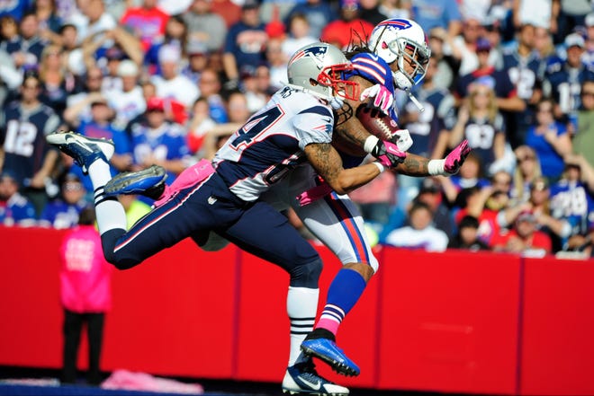 Patriots wide receiver Brian Tyms, left, makes the touchdown catch while being defended by the Bills' Stephon Gilmore during Sunday's third quarter in Orchard Park, New York.