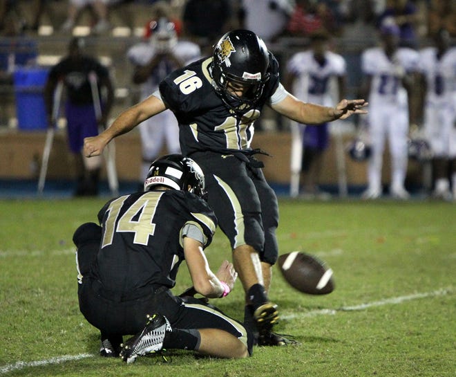 Buchholz's Coby Weiss (16) kicks a game winning 40-yard field goal against city rival Gainesville, at Citizens Field on Saturday, Oct. 10. The Bobcats beat the Hurricanes 23-20 with a field goal in the final seconds of the game and win the city championship.