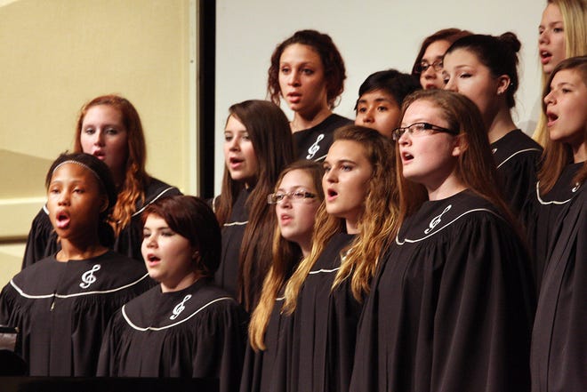 Vocalists from the Freeport High School Treble Choir sing the song “Harmony” during the Fall Concert on Tuesday, Oct. 14, 2014, in the Jeannette Lloyd Theatre at Freeport Middle School in Freeport.