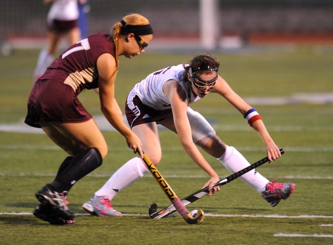 Whitehall's Victoria Marks, left, and Stroudsburg's Lizzy Cunningham battle for the ball in the EPC semifinal game on Tuesday night. For more photos go to www.poconorecord.com/photos. (Melissa Evanko/Pocono Record)