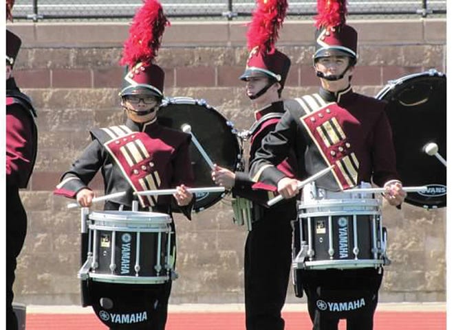 The East Peoria Community High School Marching Band drumline performs at a recent competition.
