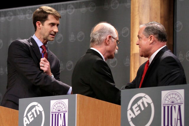 Republican candidate for U.S. Senate U.S. Rep. Tom Cotton, R-Ark., left, greets Democratic incumbent U.S. Sen. Mark Pryor, far right, as Green Party candidate Mark Swaney walks past after a televised debate at the University of Central Arkansas in Conway, Ark., Monday, Oct. 13, 2014. (AP Photo/Danny Johnston)