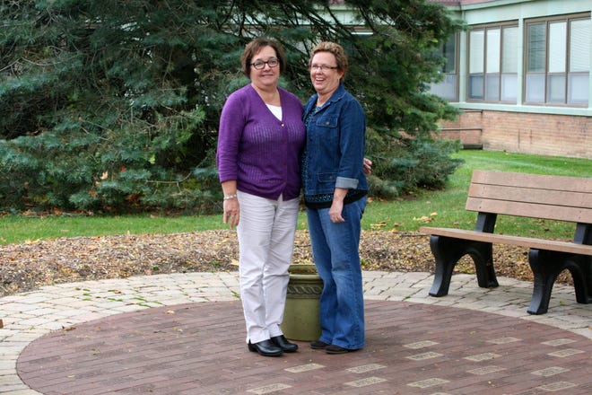 Janice Ferguson (left) and Deb Maciejewski stand in the Memory Walk at Sparrow Ionia Hospital's current location. The duo are spearheading the relocation, redesign and expansion of the garden at the new hospital site. It will be renamed the Garden of Gratitude.