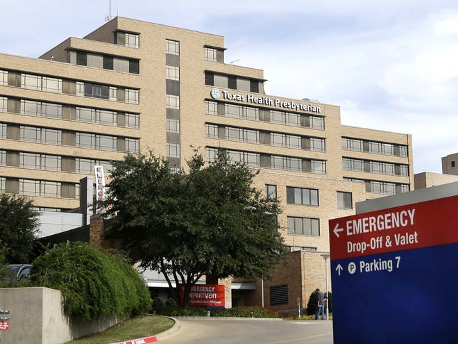 A sign points to the entrance to the emergency room at Texas Health Presbyterian Hospital in Dallas, where U.S. Ebola patient Thomas Eric Duncan was treated.