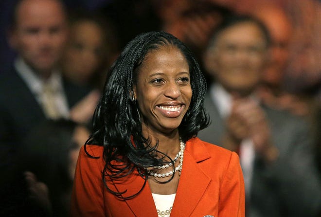 In this Oct. 8, 2014, photo, Mia Love, the Republican nominee in Utah's 4th congressional district, smiles after speaking during a rally, in Lehi, Utah.